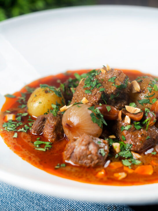 Spicy Thai beef massaman curry with potatoes, shallots and peanuts.