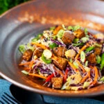 Crispy soy sauce tofu and rice vermicelli noodle salad with lots of veggies.