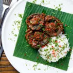 Overhead vegan mushroom rendang curry with coconut milk.