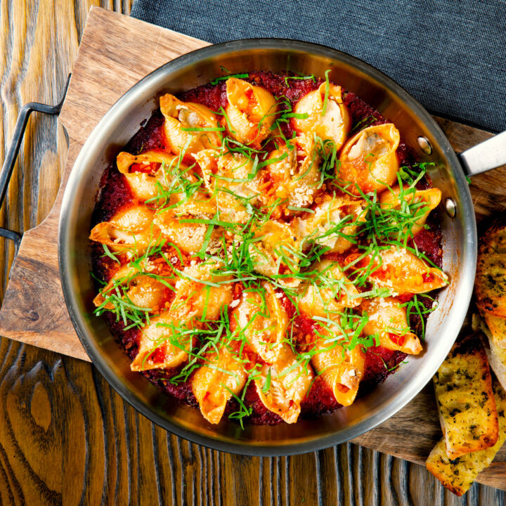 Baked stuffed pasta shells with goats cheese, peppers and ndjua.