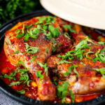 Duck leg tagine with Moroccan flavours served in a tagine.