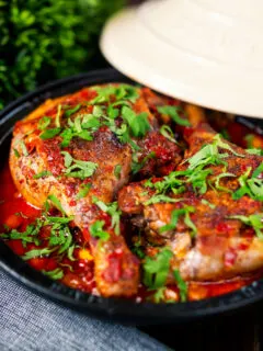 Duck leg tagine with Moroccan flavours served in a tagine.