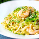 Prawn pesto pasta with linguine and fresh basil.