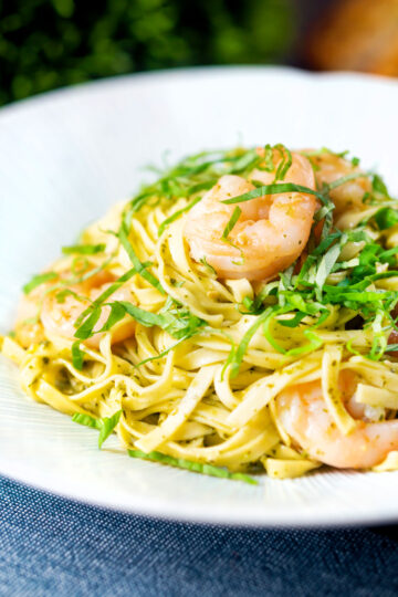 Prawn pesto pasta with linguine and fresh basil.