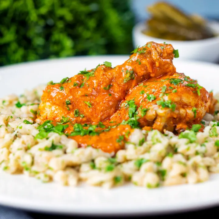 Hungarian chicken paprikash or csirkepaprikás with nokedli or dumplings.