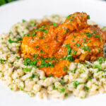 Hungarian chicken paprikash or csirkepaprik&aacute;s in a paprika sauce with nokedli.