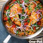 Overhead Indian influenced one pot baked chicken legs and rice in a skillet featuring a title overlay.
