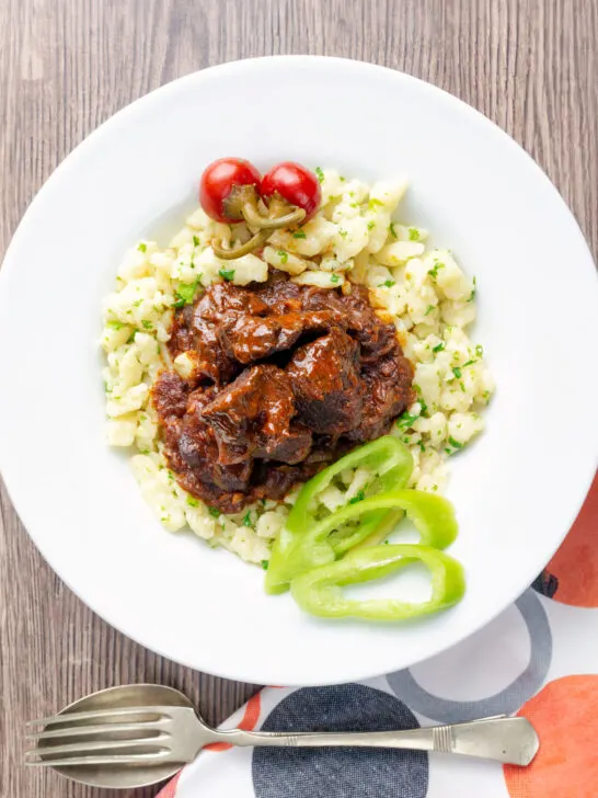 Overhead Hungarian marha porkolt beef stew with nokedli.