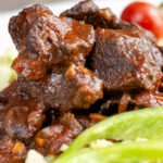 Close-up Hungarian marha porkolt beef stew with nokedli.