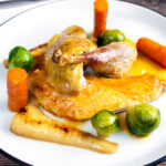 Roast guinea fowl with honey glazed vegetables.