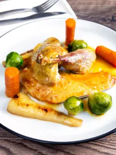 Roast guinea fowl with honey glazed vegetables.