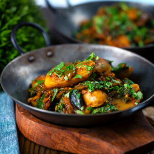 North Indian Vegan saag aloo or spinach and potato curry with chapatis.
