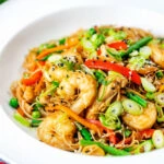 Curry Singapore chow mein noodles with chicken and prawns.