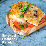 Smoked haddock rarebit on toast with tomatoes garnished with chives featuring a title overlay.