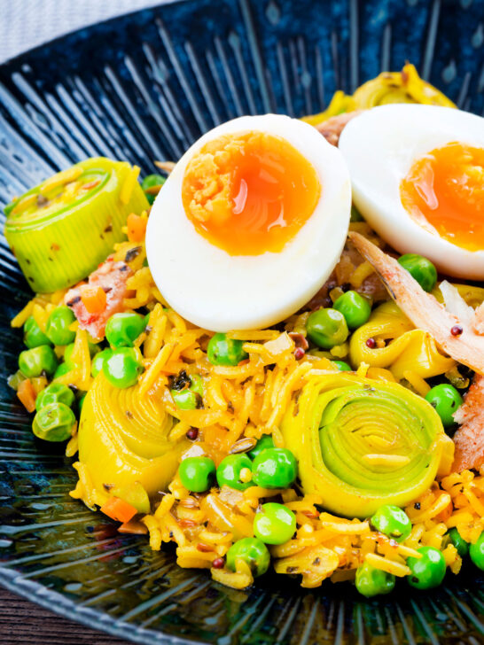 Easy smoked mackerel kedgeree with leeks, peas topped and a boiled egg.