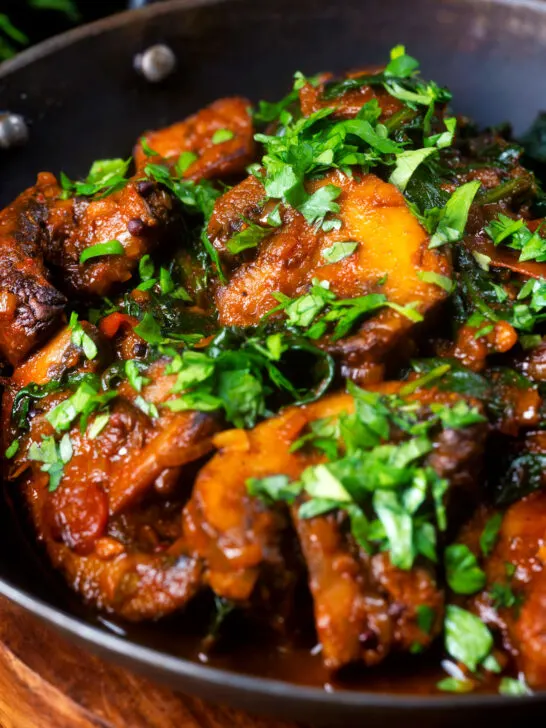 Close-up vegan spinach and mushroom Indian inspired curry.