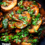 Overhead close-up vegan spinach and mushroom Indian inspired curry featuring a title overlay.