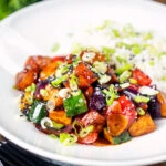 Vegan sweet and sour tofu with pineapple, veggies and rice.