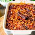 Greek baked youvetsi or giouvetsi with lamb and orzo in a baking dish.