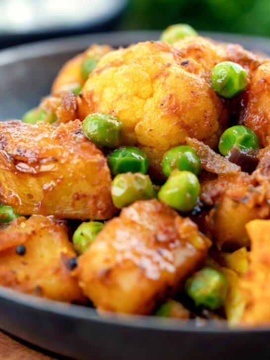 Close-up aloo gobi matar an Indian potato, cauliflower and pea curry.