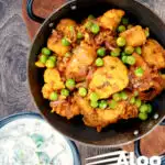 Overhead aloo gobi matar an Indian potato, cauliflower and pea curry featuring a title overlay.