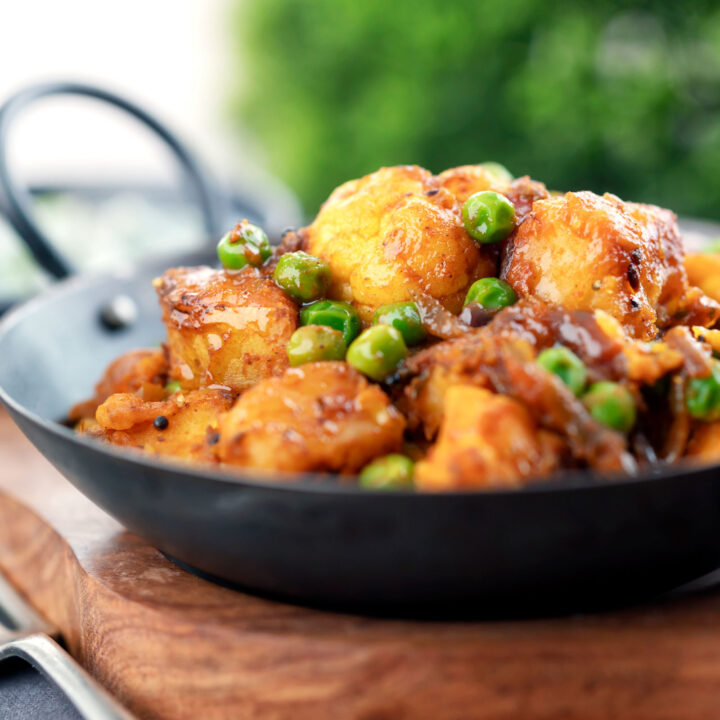 Vegan aloo gobi matar or Indian potato, cauliflower and pea curry.