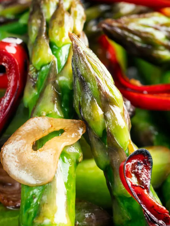 Close-up asparagus stir fry with soy sauce garlic and chilli.