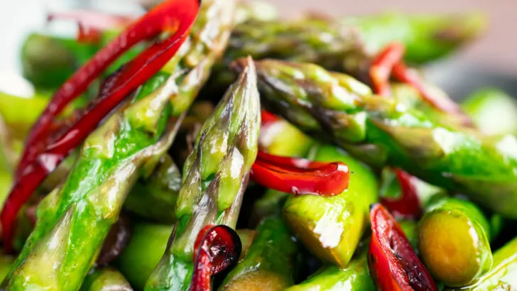 Quick and easy Asparagus stir fry with soy sauce, garlic and fresh chilli.
