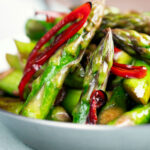 Stir fried asparagus with soy sauce, garlic and chilli.