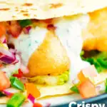 Close-up beer battered crispy cod fish tacos in a corn tortilla featuring a title overlay.