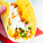 Crispy fried cod fish tacos with a salsa and coriander crema.