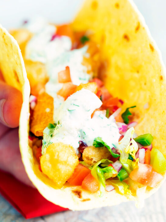 Beer battered crispy cod fish tacos in a corn tortilla.