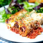 Minced beef stuffed cannelloni with bechamel and mozzarella cheese served on a plate featuring a title overlay.