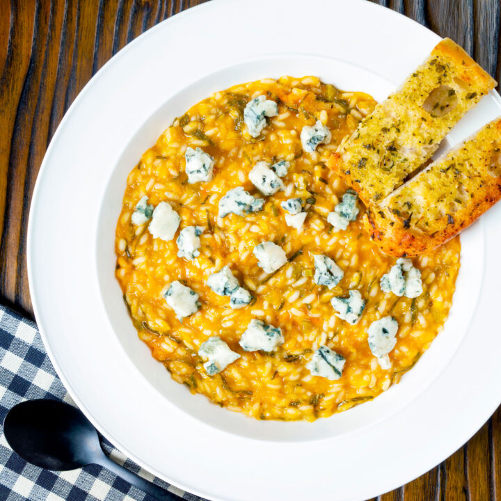 Roasted butternut squash risotto with sage and blue cheese served with garlic bread.