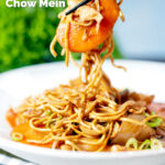 British Chinese takeaway style chicken chow mein noodles being picked up with chopsticks featuring a title overlay.