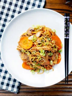 Overhead British Chinese takeaway style chicken chow mein noodle stir fry.