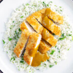 Overhead crispy fried chicken katsu curry with homemade kare sauce served with rice.