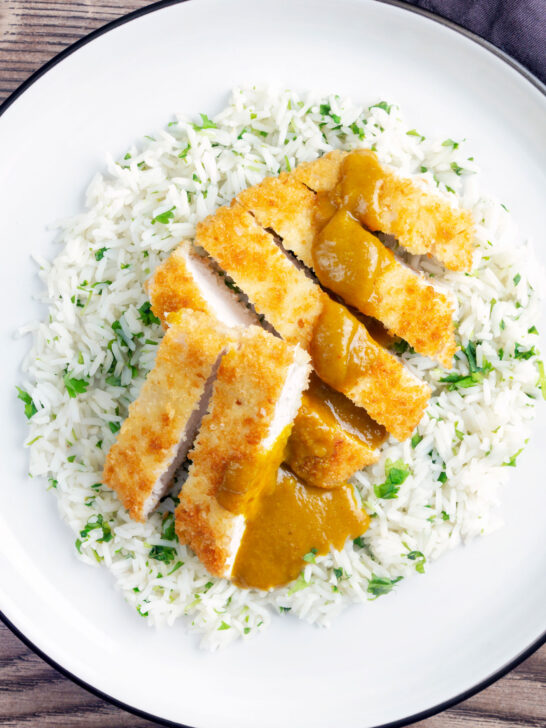 Overhead crispy fried chicken katsu curry with homemade kare sauce served with rice.