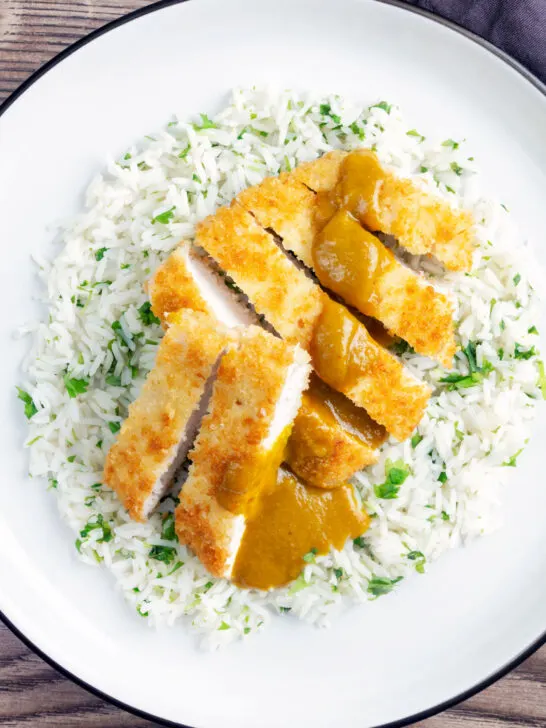 Overhead crispy fried chicken katsu curry with homemade kare sauce served with rice.