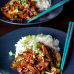 Spicy steak and shiitake mushroom stir fry serve with rice.