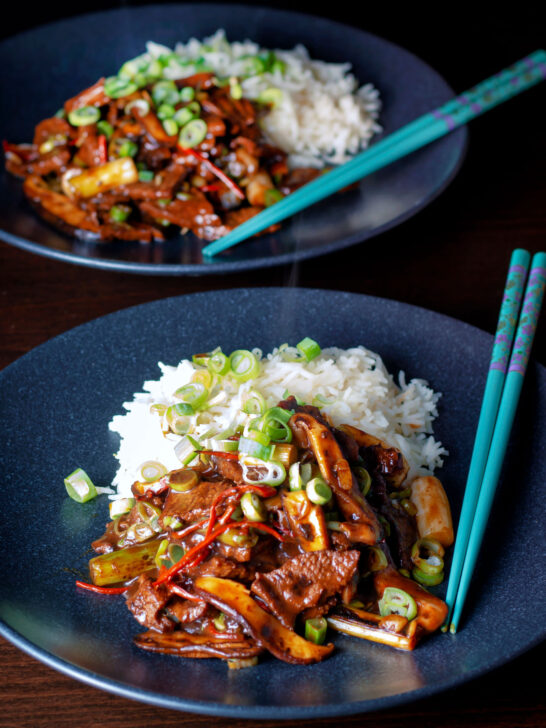 Spicy steak and shiitake mushroom stir fry serve with rice.