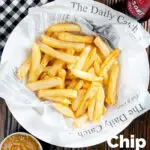 Overhead chip shop style chippy chips served with a side of curry sauce featuring a title overlay.