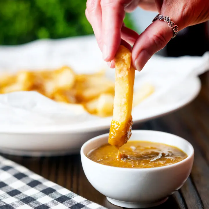 British chip shop chips dipped into homemade chippy style curry sauce.