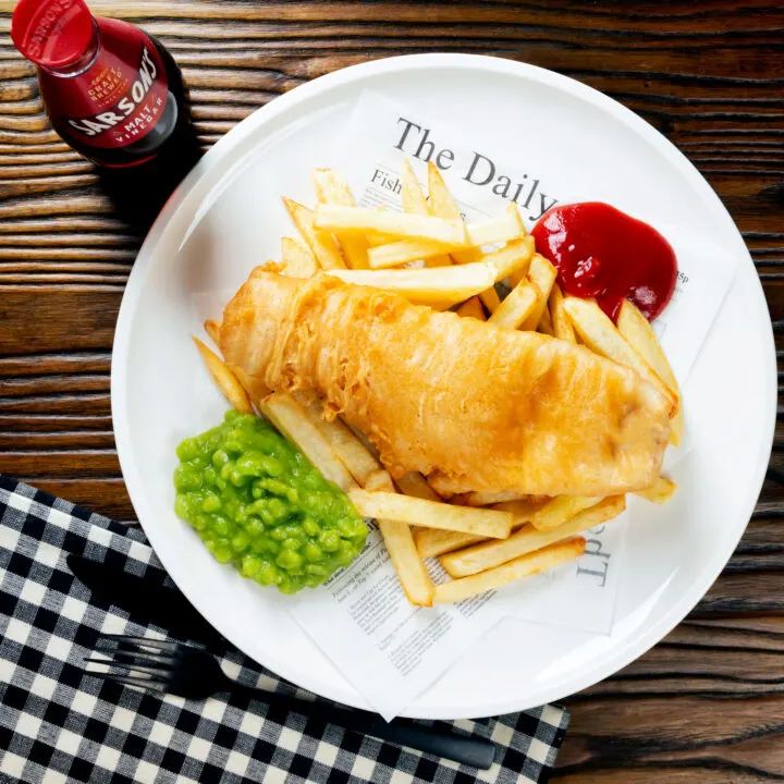 Chip shop style fish (haddock) in a crispy batter with chips, mushy peas and ketchup.