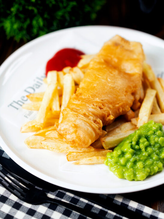 Chip shop style fried battered fish served with chips and mushy peas.