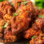 Close-up crispy fried spicy buttermilk chicken wings.