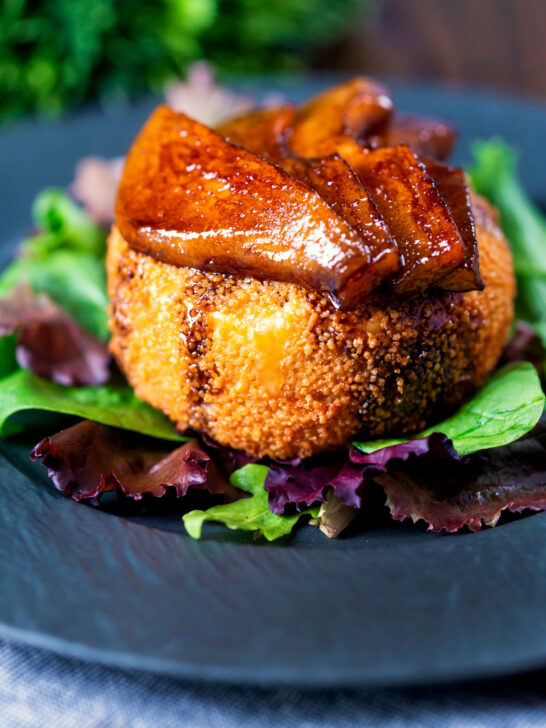 Fried camembert cheese with a couscous crumb served with balsamic glazed pears.