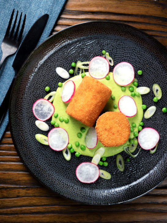Overhead fried crumbed goat cheese with sweet pea puree, radishes and spring onions.