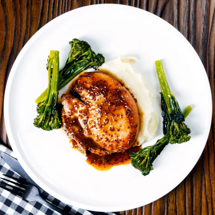 Honey mustard pork chops with roasted tenderstem broccoli and mashed potato.