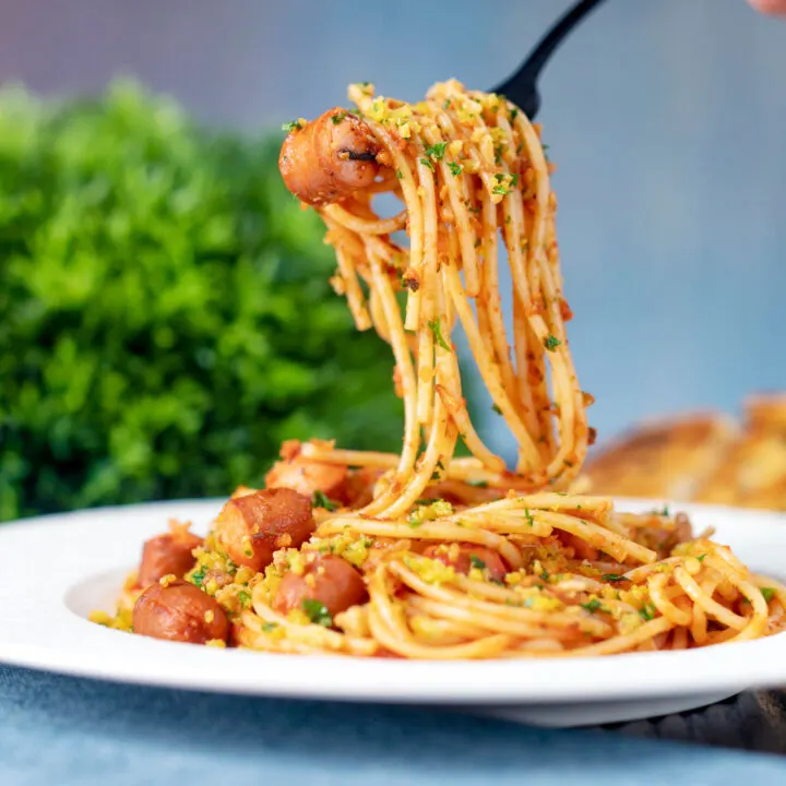 Hot dog pasta, tomato sauce spaghetti with a mustard crumb and crispy onions.